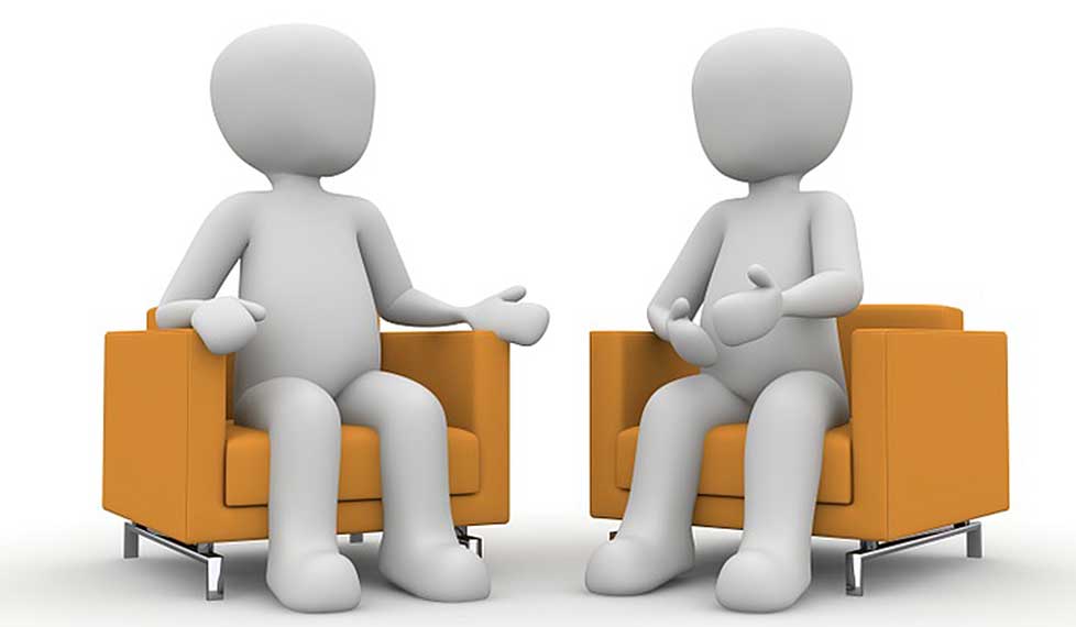 two grey animated people sitting opposite each other on orange armchairs